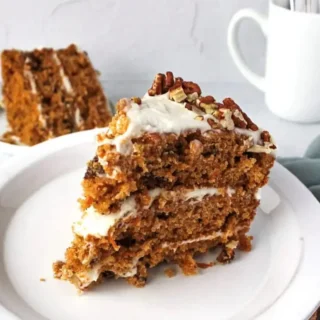 Deliciously Moist Carrot Cake: Bake Your Happy Moment! 8 Deliciously moist carrot cake slice with cream cheese frosting